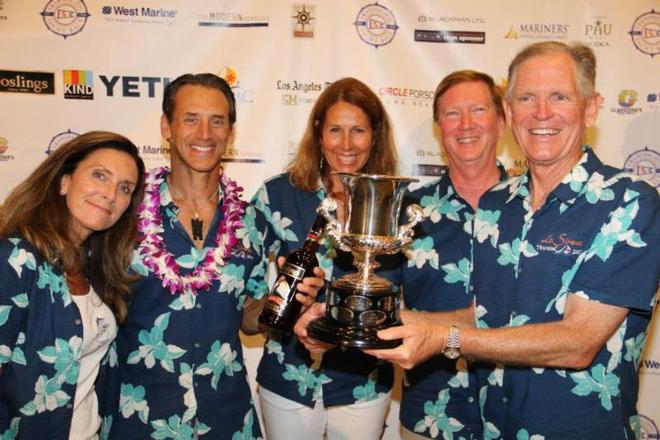 The crew of La Sirena not only accept their 3rd place award in Div 5, but one of the crew perpetuates another Transpac tradition: proposing marriage to a loved one - 2017 Transpac ©  David Livingston